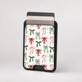 Christmas Bow and Mistletoe MagSafe card holder showing the patterned front