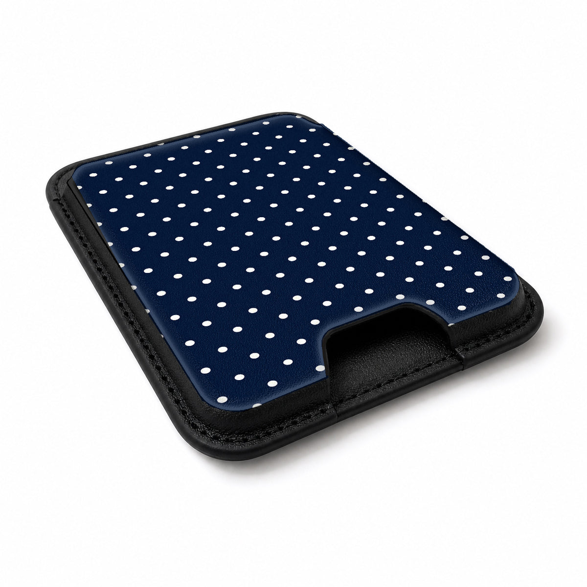 Navy Mini Polka Dot MagSafe card holder showing the angled leather surface