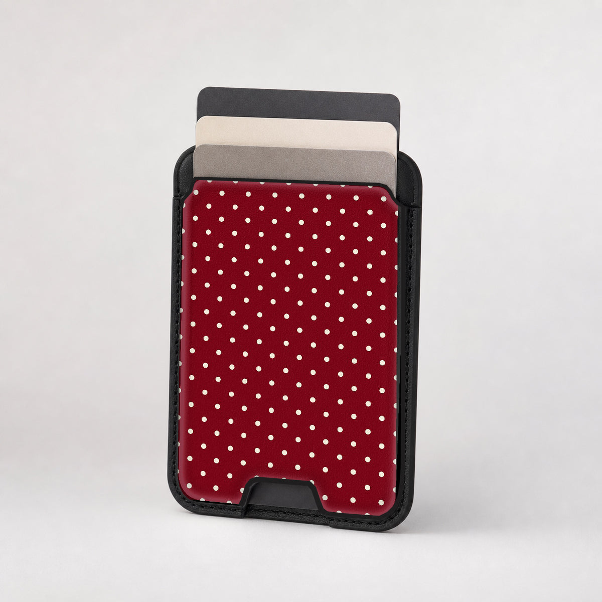 Burgundy Mini Polka Dot MagSafe card holder showing the patterned front