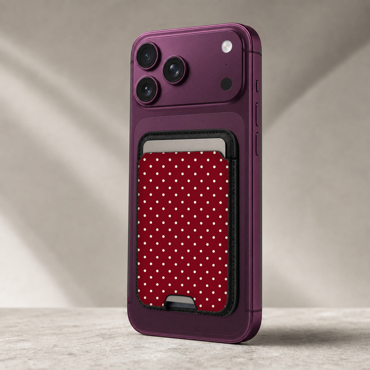 Burgundy Mini Polka Dot MagSafe card holder showing the detailed leather finish