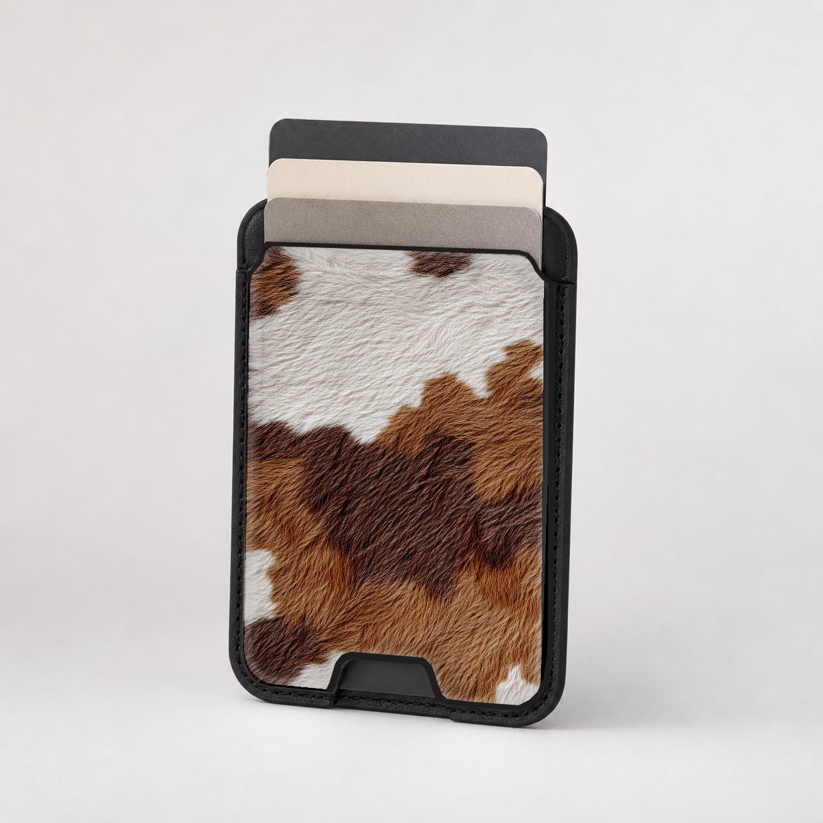 Highland Cowhide Print MagSafe card holder showing the patterned front