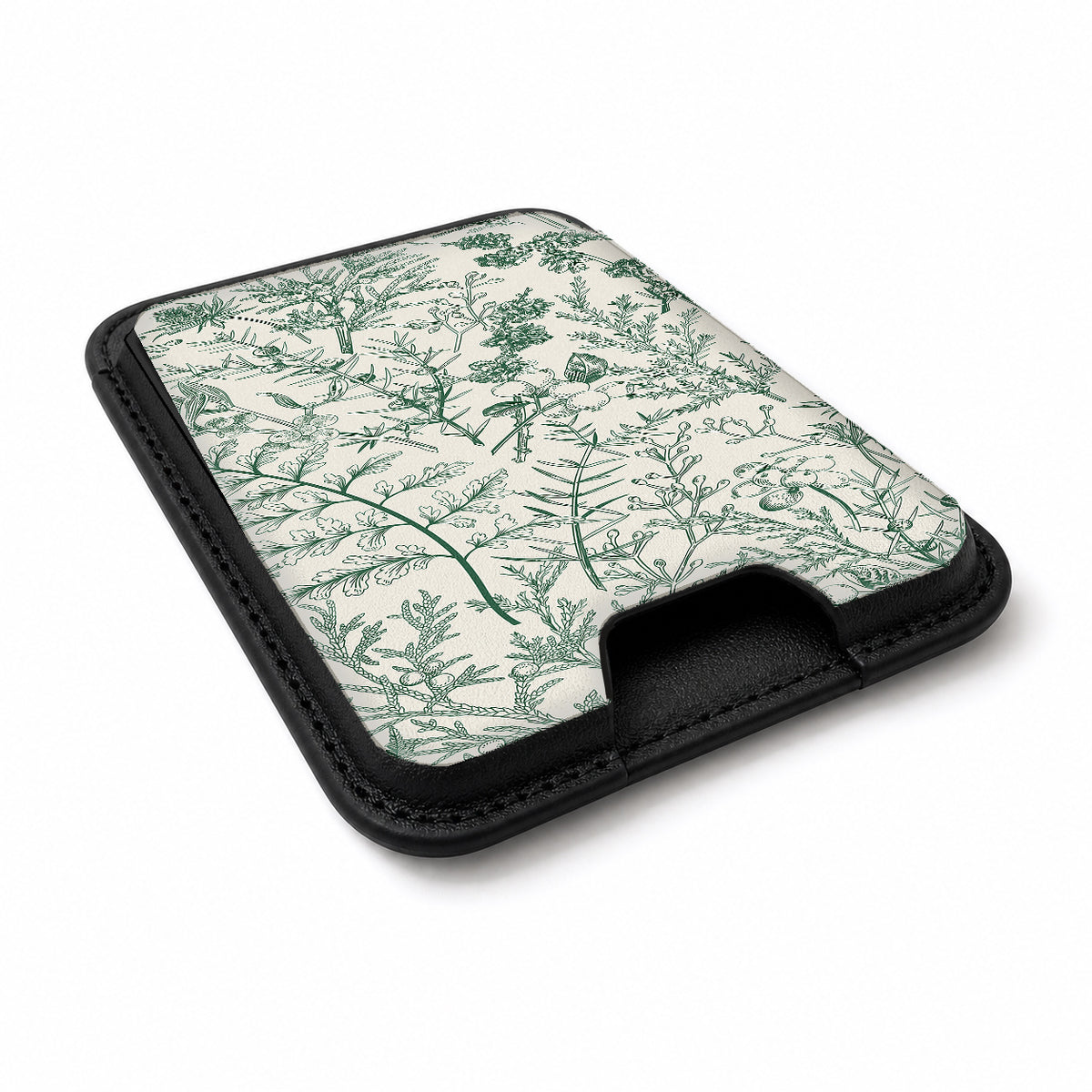 Green Toile Botanical MagSafe card holder showing the angled leather surface