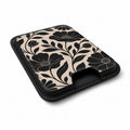 Black Cream Oversized Floral MagSafe card holder showing the angled leather surface