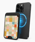 Pastel Quilt Patchwork MagSafe card holder attached to a compatible iPhone