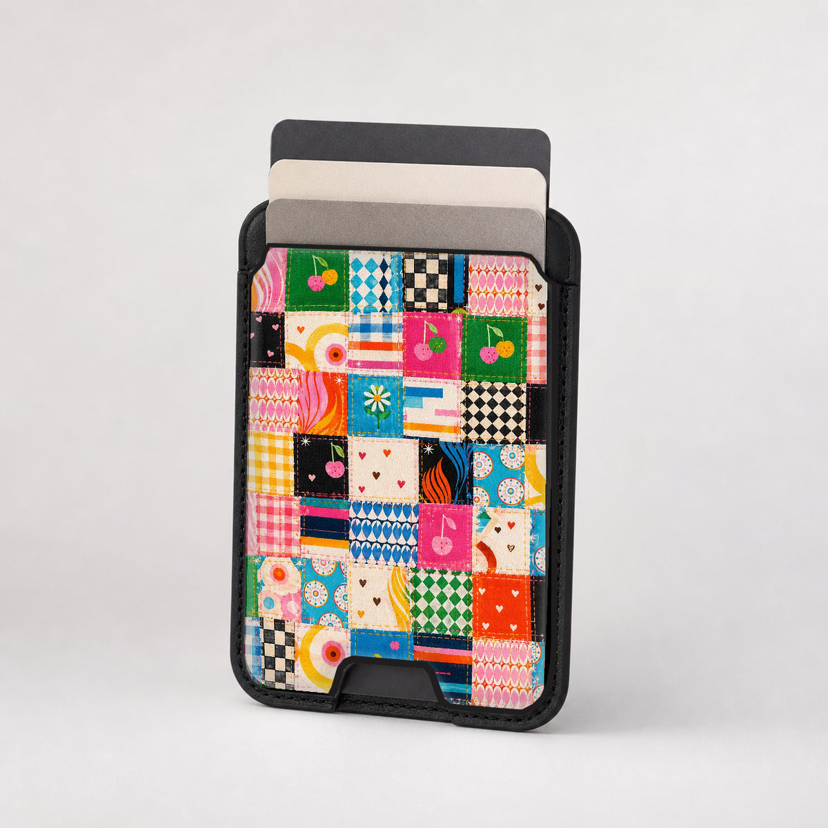 Colorful Folk Quilt Patchwork MagSafe card holder showing the patterned front