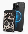 Black Cream Bold Floral MagSafe card holder attached to a compatible iPhone