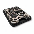Black Cream Bold Floral MagSafe card holder showing the angled leather surface