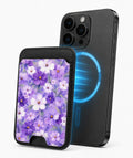 Lavender Daisy Floral MagSafe card holder attached to a compatible iPhone