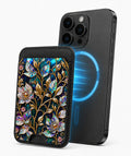 Midnight Ornate Jewel Floral MagSafe card holder attached to a compatible iPhone