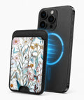 Blue White Daisy Wildflower MagSafe card holder attached to a compatible iPhone