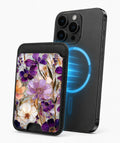 Purple Pressed Flower Garden MagSafe card holder attached to a compatible iPhone