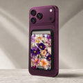 Purple Wildflower Glass Garden MagSafe card holder showing the detailed leather finish