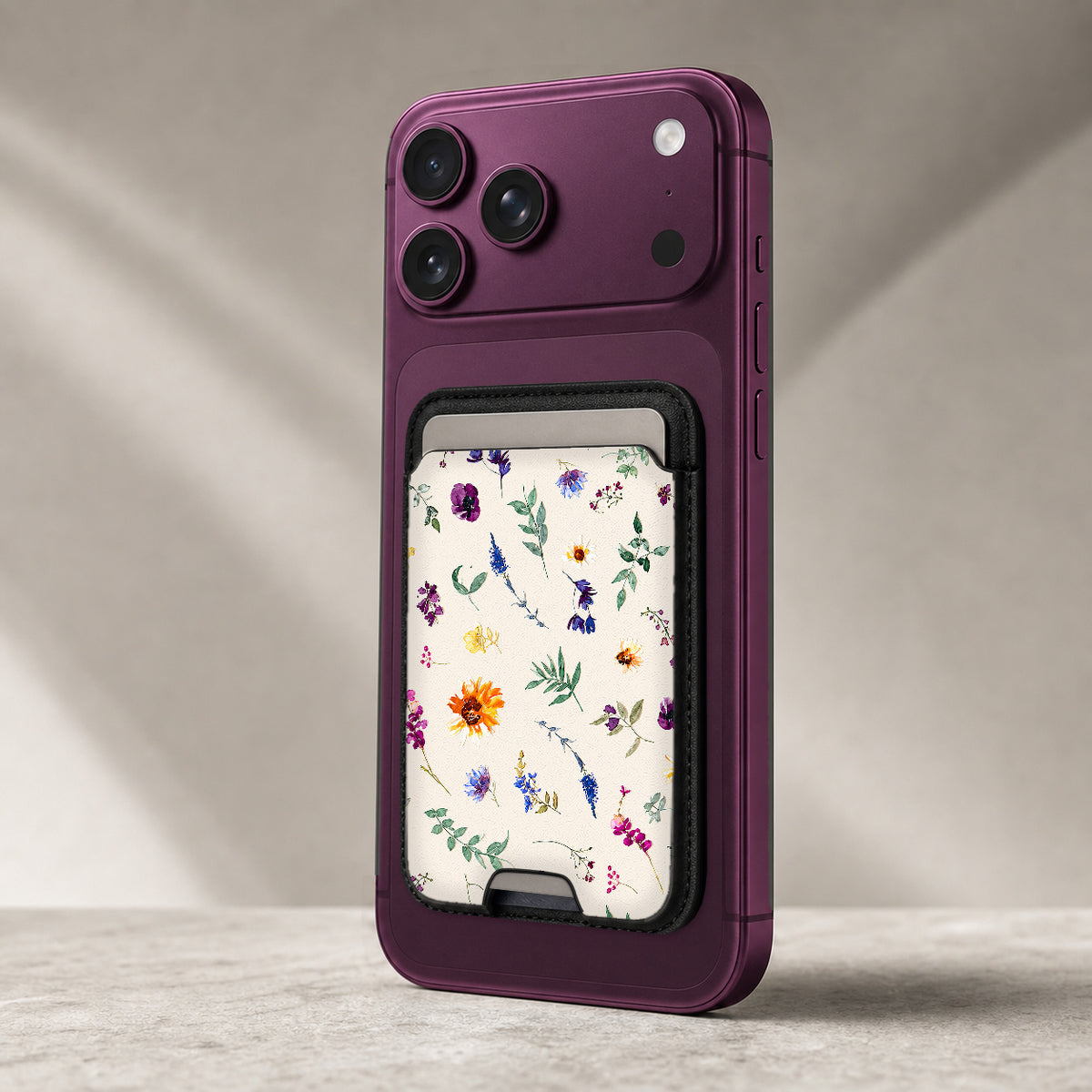 Delicate Mixed Wildflower MagSafe card holder showing the detailed leather finish
