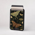 Dark Moth Botanical MagSafe card holder showing the patterned front