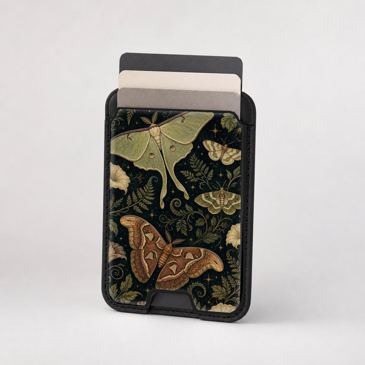 Dark Moth Botanical MagSafe card holder showing the patterned front