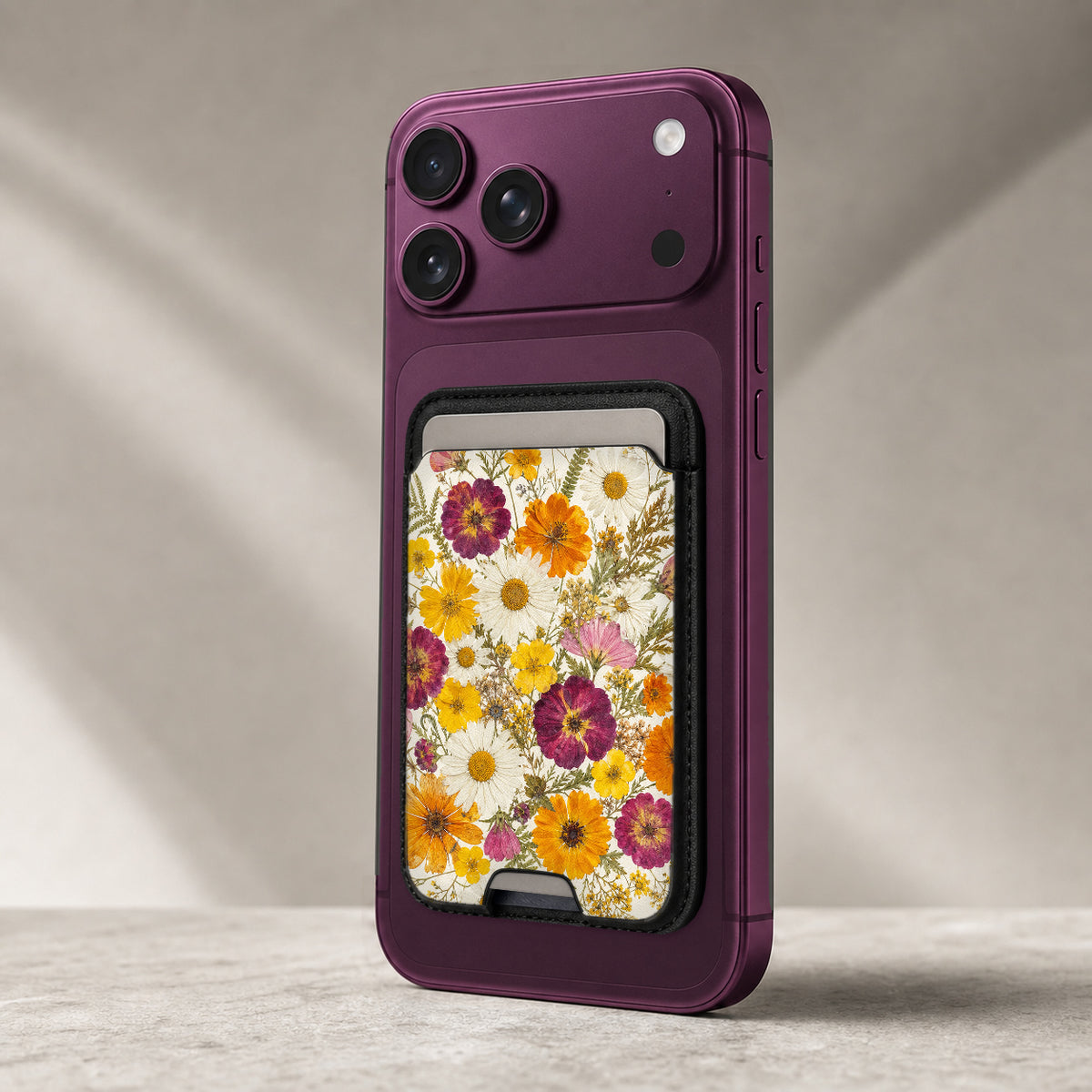 Pressed Daisy Wildflower Bouquet MagSafe card holder showing the detailed leather finish