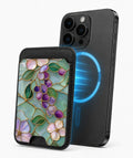 Aqua Grape Stained Glass Floral MagSafe card holder attached to a compatible iPhone