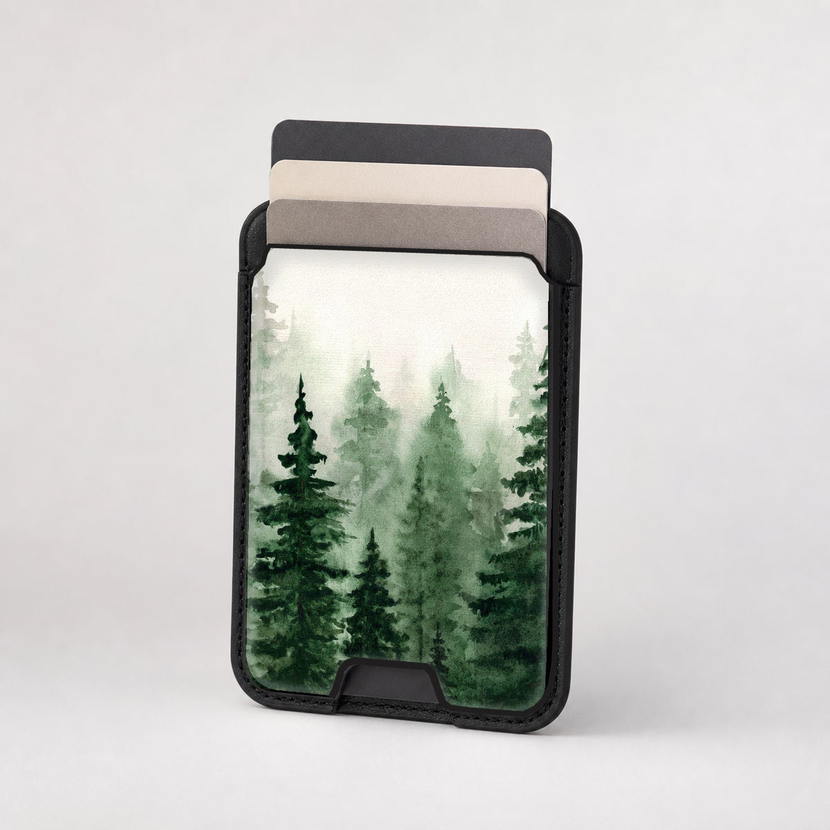 Misty Evergreen Forest MagSafe card holder showing the patterned front