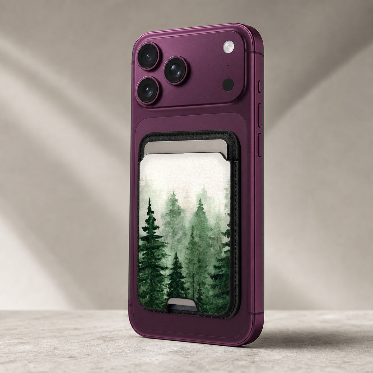 Misty Evergreen Forest MagSafe card holder showing the detailed leather finish