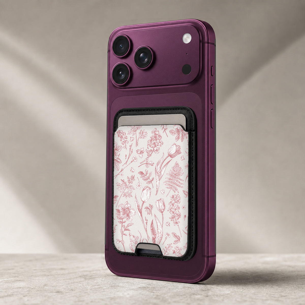 Pink Toile Wildflower MagSafe card holder showing the detailed leather finish