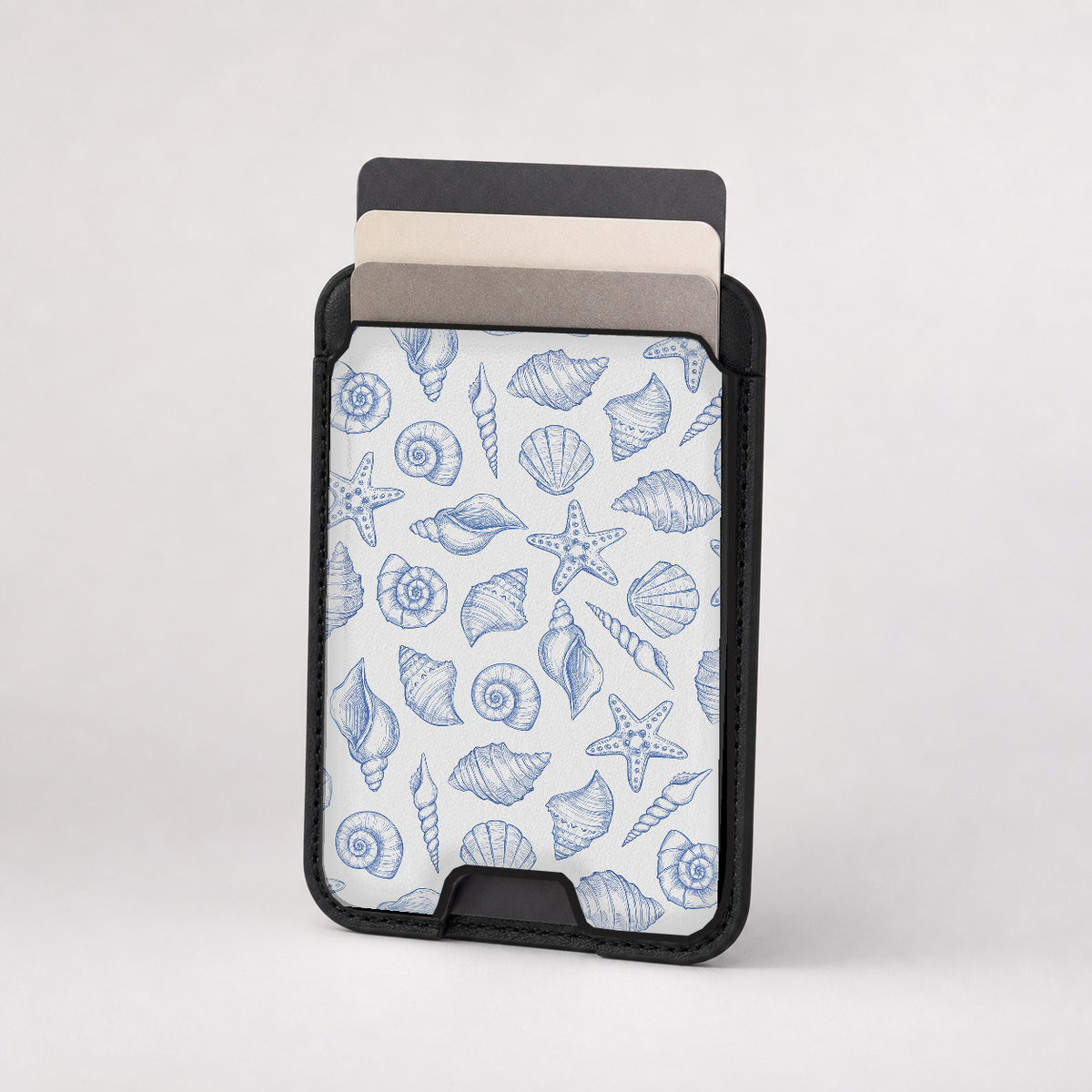 Blue Coastal Seashell MagSafe card holder showing the patterned front