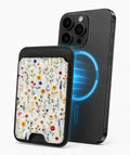 Colorful Pressed Wildflower MagSafe card holder attached to a compatible iPhone