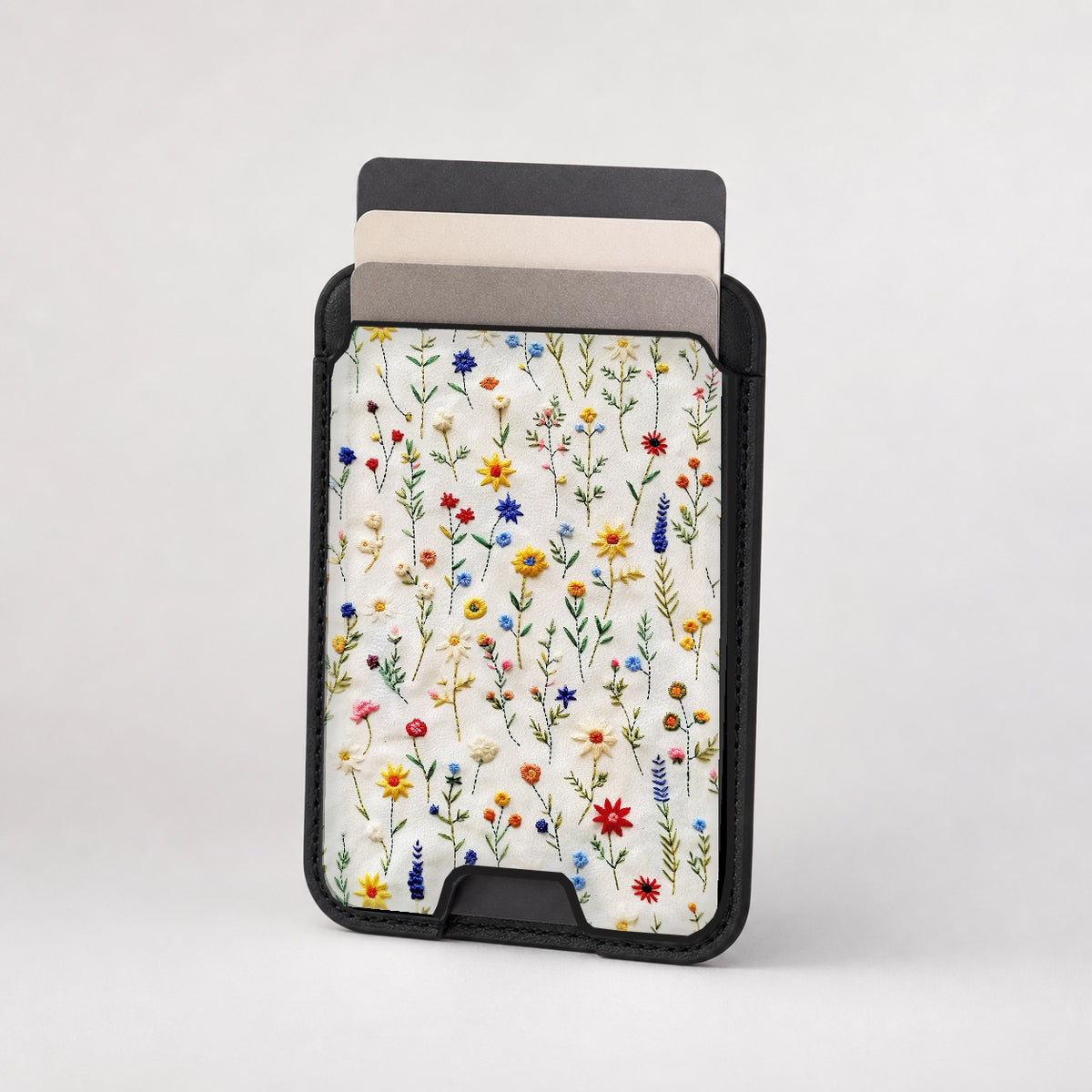 Colorful Pressed Wildflower MagSafe card holder showing the patterned front