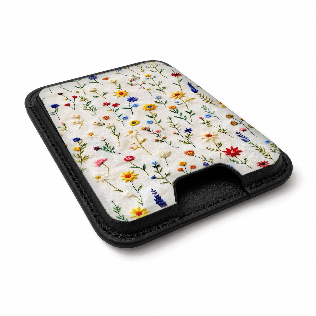 Colorful Pressed Wildflower MagSafe card holder showing the angled leather surface