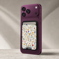 Colorful Pressed Wildflower MagSafe card holder showing the detailed leather finish