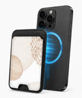 Beige Abstract Pebble MagSafe card holder attached to a compatible iPhone