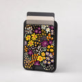 Black Folk Garden Floral MagSafe card holder showing the patterned front