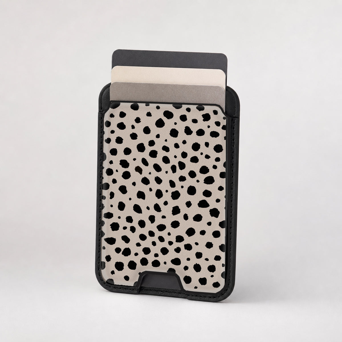 Black Dalmatian Spot MagSafe card holder showing the patterned front