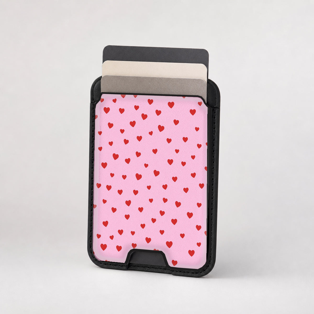 Tiny Red Hearts MagSafe card holder showing the patterned front