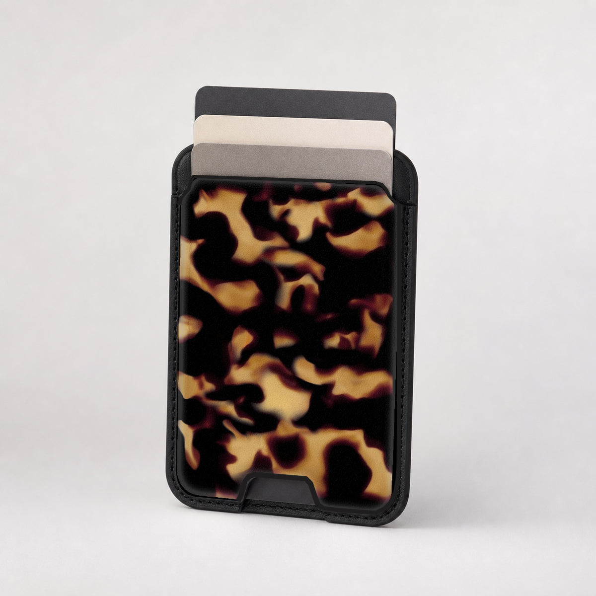 Tortoiseshell MagSafe card holder showing the patterned front