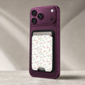 Pink Ditsy Floral MagSafe card holder showing the detailed leather finish