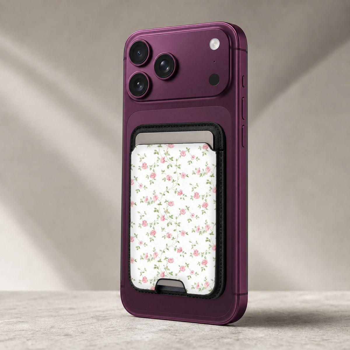 Pink Ditsy Floral MagSafe card holder showing the detailed leather finish
