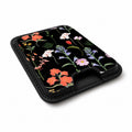 Black Wildflower Meadow MagSafe card holder showing the angled leather surface