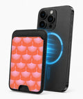Coral Pink Scallop MagSafe card holder attached to a compatible iPhone