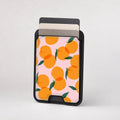 Orange Fruit on Pink MagSafe card holder showing the patterned front