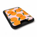 Orange Fruit on Pink MagSafe card holder showing the angled leather surface
