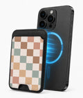 Pastel Multicolor Checkerboard MagSafe card holder attached to a compatible iPhone