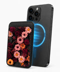 Dark Autumn Daisy Floral MagSafe card holder attached to a compatible iPhone