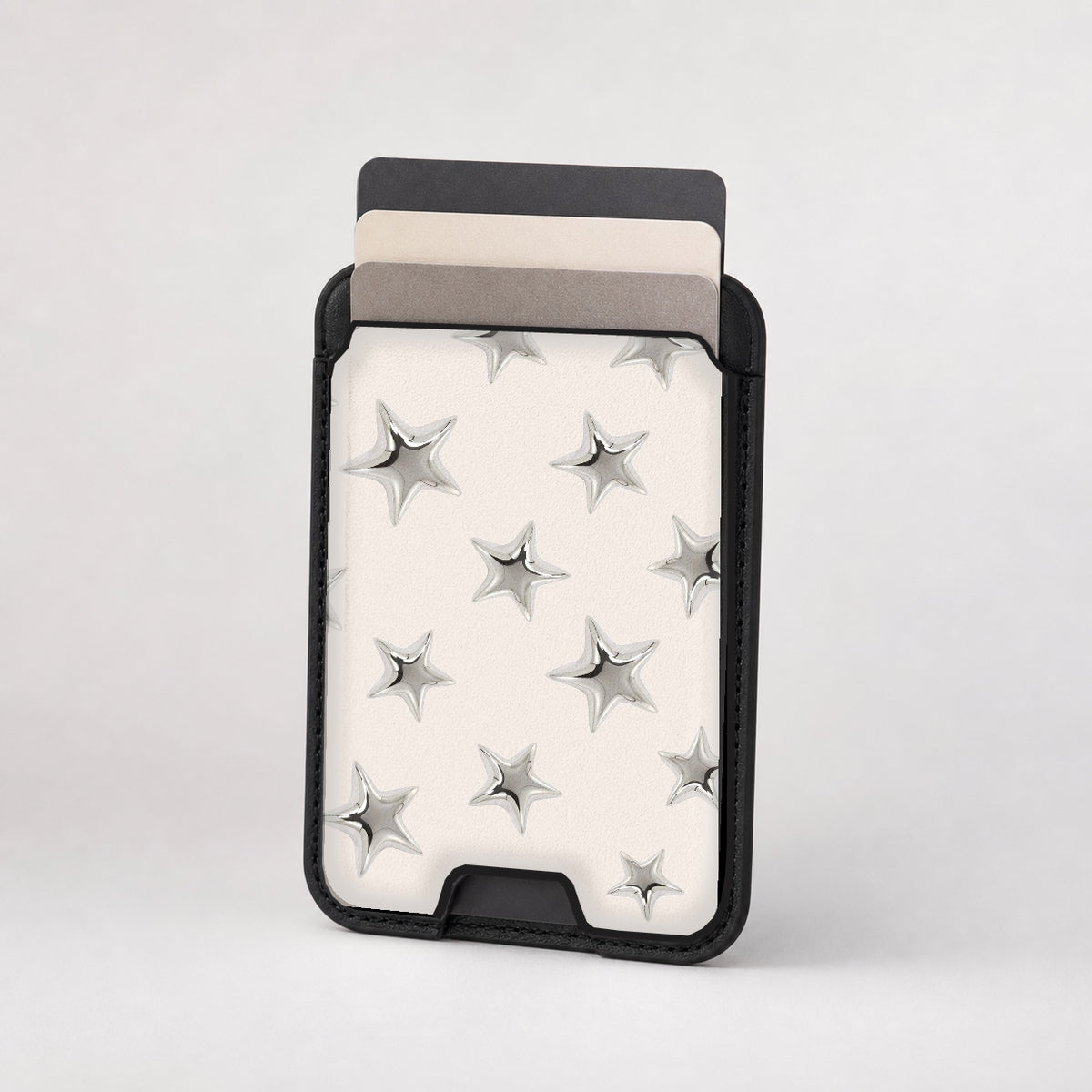 Silver Puffy Star MagSafe card holder showing the patterned front