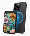 Jewel Tone Stained Glass Floral MagSafe card holder attached to a compatible iPhone