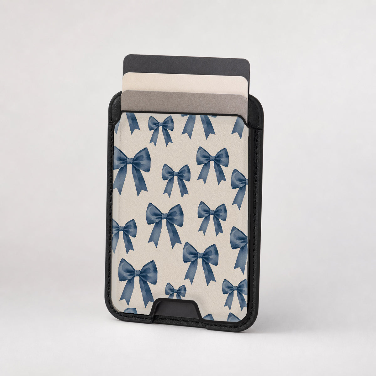 Blue Coquette Bow MagSafe card holder showing the patterned front