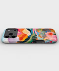 Colorful Mountain Garden MagSafe iPhone Tough Case low angle lifestyle product view