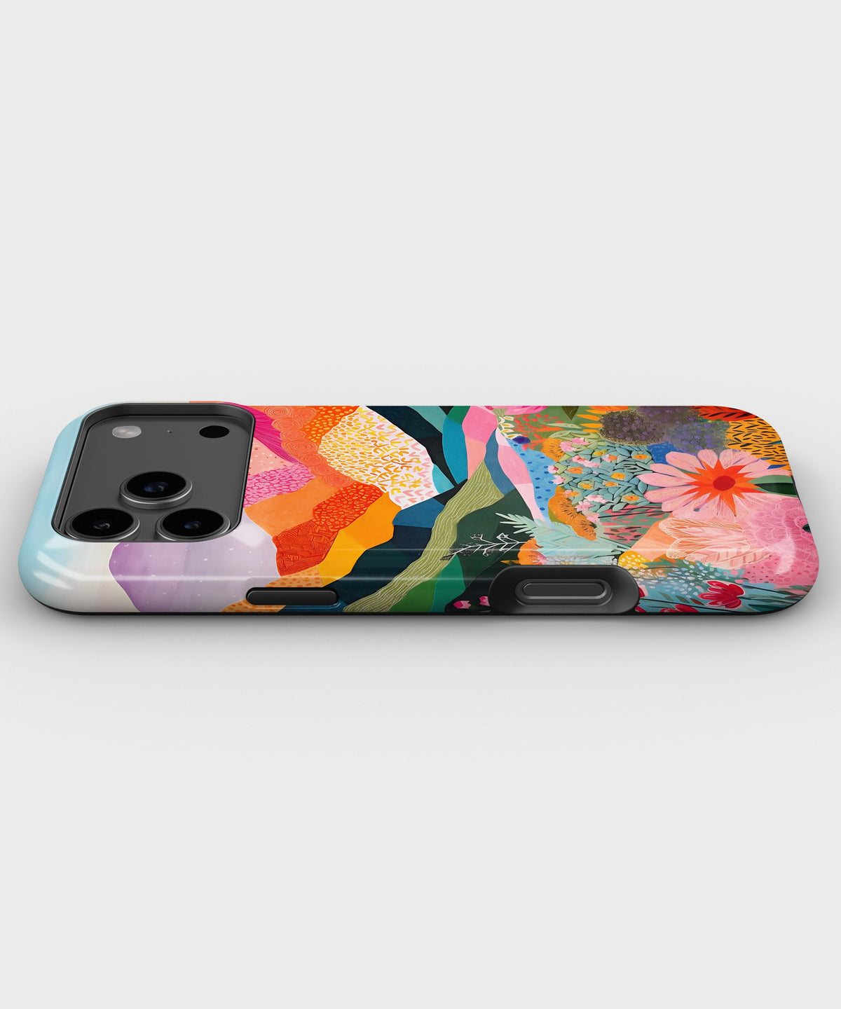 Colorful Mountain Garden MagSafe iPhone Tough Case low angle lifestyle product view