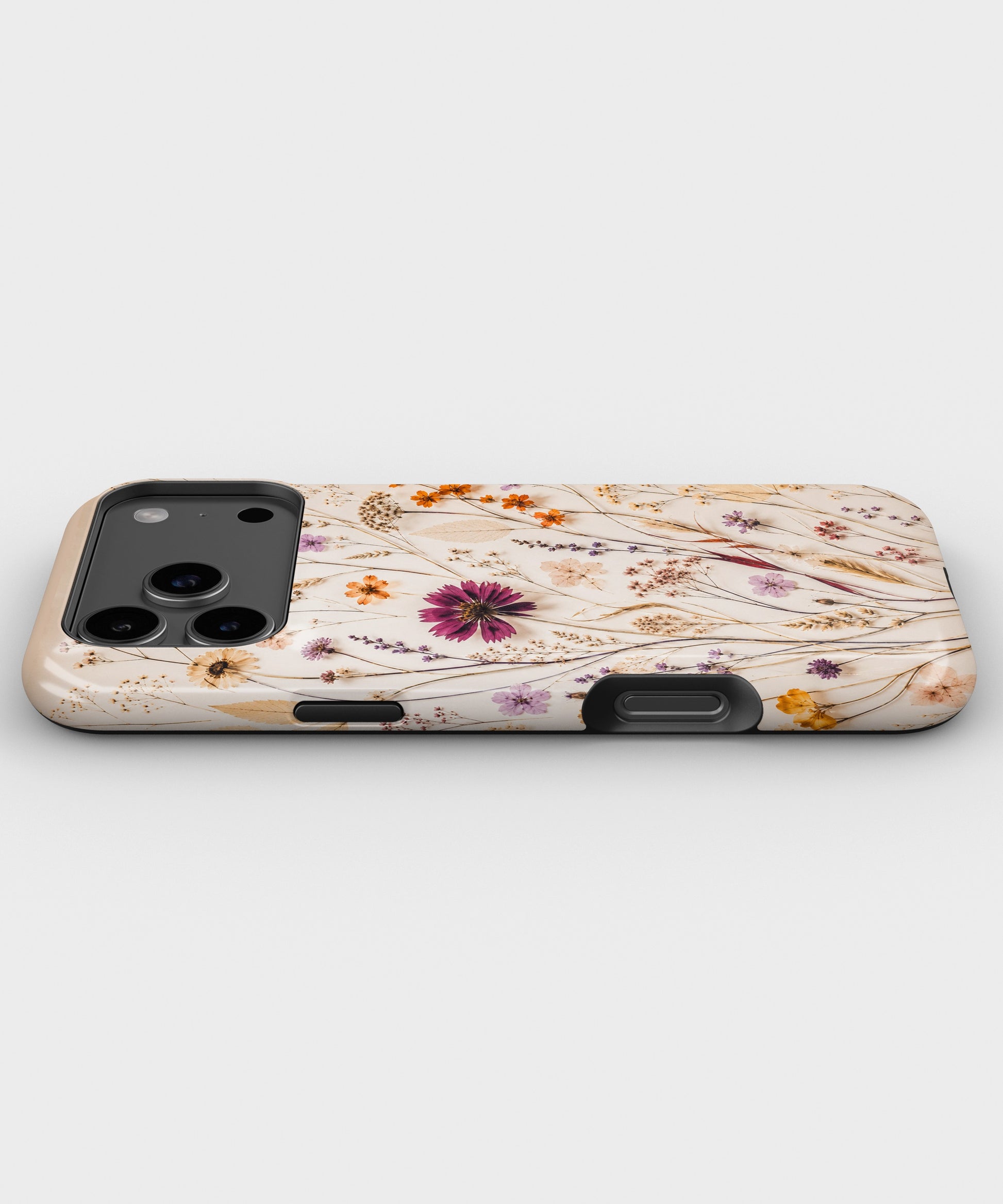 Pressed Wildflower Meadow MagSafe iPhone Tough Case low angle lifestyle product view