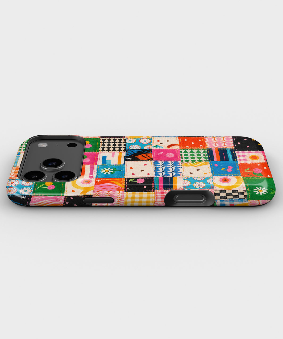 Colorful Patchwork Quilt MagSafe iPhone Tough Case low angle lifestyle product view