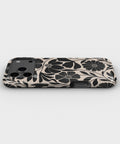 Black Cream Retro Floral MagSafe iPhone Tough Case low angle lifestyle product view